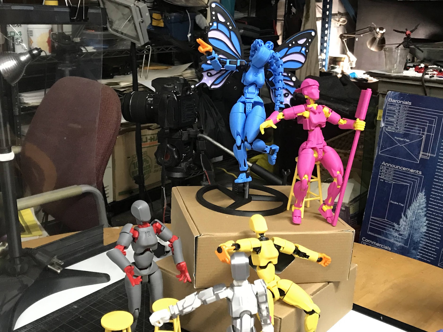 3D-printed Dummy Dolls posed in a workshop set