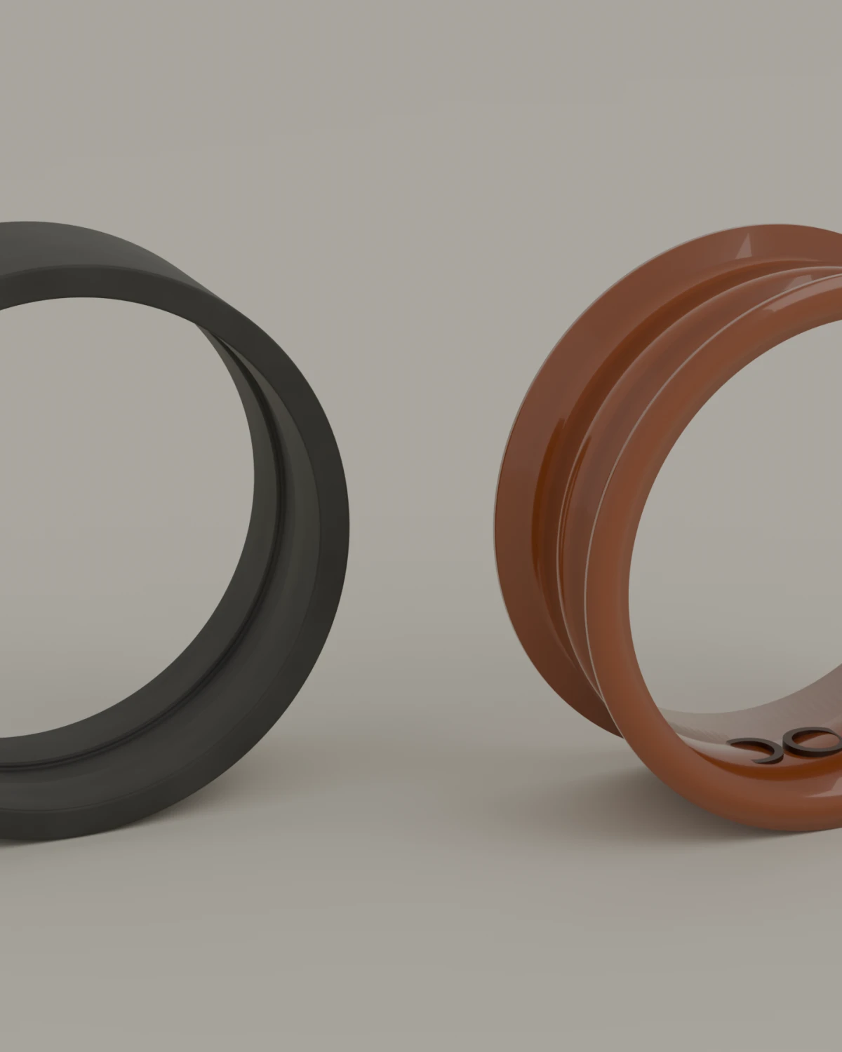 The ring held apart: the grey outer band, the amber liner, and the word LOOK that sits inside the liner.