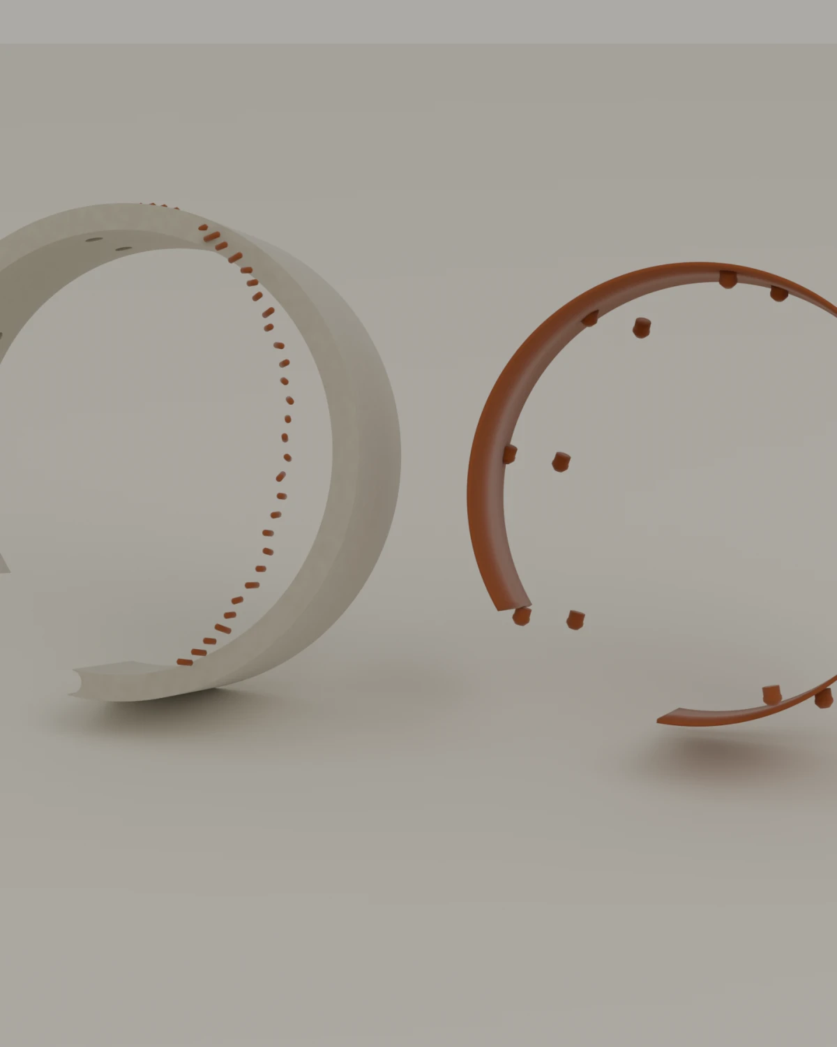 The cuff held apart: the pale shell, the amber lining, the raised stitches in a line, and the horn pin that closes it.
